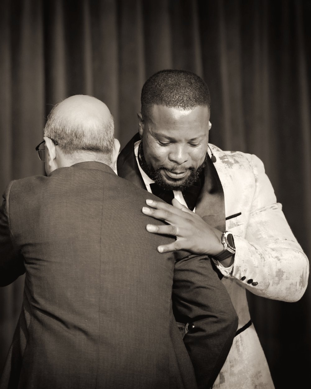 Lebo Mokoena greeting a guest after the programme