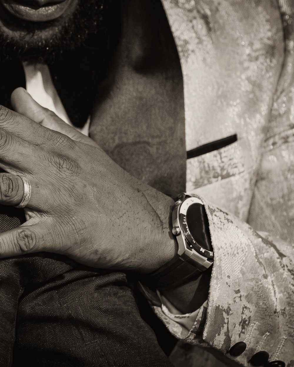 A hand on a shoulder — a private word after the room has cleared